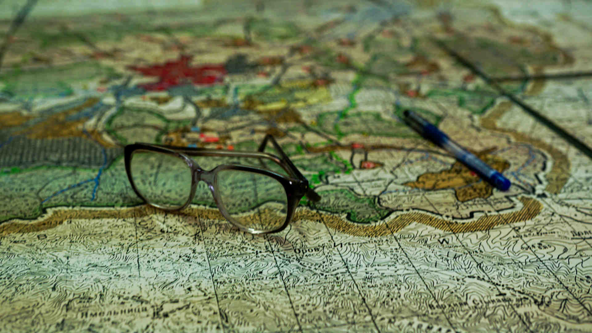 A pair of glasses on a map